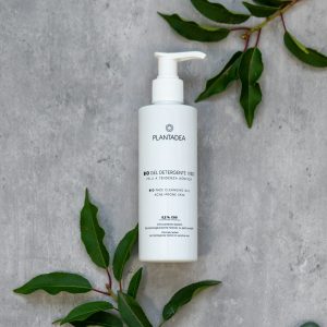 a bottle of cleanser sitting on top of a table