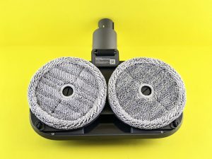 Robot vacuum cleaner head with two rotating pads.